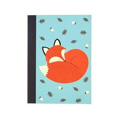 a notebook with an image of a sleeping fox on it's back and leaves flying around