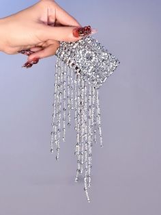 Enhance your cyberpunk look with our stunning cyberpunk silver gothic tassels beads stretch bracelet. This edgy and versatile bracelet features intricate tassels and beads, adding a touch of gothic flair to any outfit. Whether you're attending a music festival or a night out with friends, this stretch bracelet is the perfect accessory to make a bold fashion statement.  Please note that this product includes only one bracelet.  Garment Size   	 		 			Size 			Free Size 		 		 			Adjustable Circumference 			16-26 		 		 			Width 			5.5+12 Silver Jewelry With Beaded Fringe For Festivals, Festival Silver Fringe Jewelry, Party Beaded Chain Bracelets, Trendy Silver Fringe Jewelry, Silver Party Jewelry With Beaded Fringe, Silver Beaded Bracelets With Chain For Party, Silver Beaded Bracelet With Chain For Party, Cyberpunk Look, Steampunk Heart