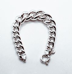 Brand: Argentidea Jewelry Instagram: https://www.instagram.com/gioielli_argentidea/ Measurement: 20.5 cm Weight: 47g. Silver colour Eye-catching women's bracelet, in 925 silver, grumetta chain with graduated links. The bracelet is a gradual lump link chain, the central measurement has a width of 20 mm up to the final links which have a width of 12 mm. The bracelet features a spring ring clasp with two micro-cast ends for a better finish. The bracelet is the natural color of silver, manually poli Modern Chunky Silver Jewelry, Modern Chunky Bracelets As Gift, Modern Chunky Silver Bracelet, Modern Chunky Bracelet For Gift, Chunky Sterling Silver Bracelet As Gift, Chunky Sterling Silver Bracelets As Gift, Chunky Silver Bracelet Jewelry, Elegant Chunky Silver Chain Bracelet, Jewellery Bracelets