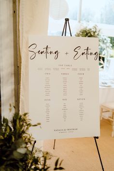 a seating chart is displayed on a easel