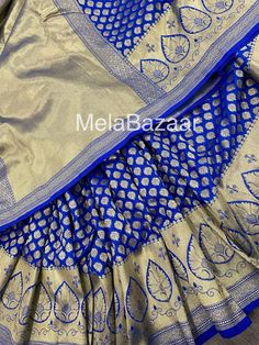 Dazzling royal blue Katan silk blend Banarsi saree. Dense gold  zari butas and tassels on the palla! Blouse fabric included. Fall attached. Note: The color of the products may slightly vary according to the lighting conditions and the color calibration of the viewing LED devices. If you would like more clarity before your purchase, please drop us a message . Banarsi Saree, Katan Silk, Color Calibration, Blouse Fabric, Royal Blue, Tassels, Bathing Beauties, Saree, Electronic Accessories