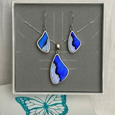 Celebrate the essence of beauty and transformation this Mother's Day with our exquisite sterling silver jewelry set. This set is not just a piece of jewelry, it's a symbol of love and growth. It features a combination of real Morpho Sulkowskyi and blue Morpho butterfly wings, symbolizing the transformative journey of motherhood. Each iridescent wing is delicately encased in a sterling silver teardrop setting, creating an enchanting shine that captures the eye. Choose from our elegant chain optio Butterfly Nature, Blue Morpho Butterfly, Morpho Butterfly, Blue Morpho, Silver Jewellery Sets, Butterfly Jewelry, Silver Butterfly, Perfect Gift For Mom, Nature Jewelry