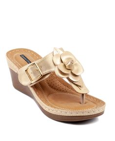 Bring out your nature-loving style with the floral sandal from Gc Shoes. These wedges have a cushioned foot bed for long lasting comfort and floral appliques for a feminine finish. Gold Toe Post Wedge Sandals For Summer, Gold Cushioned Wedge Sandals, Adjustable Toe Post Wedge Sandals, Gold Adjustable Wedge Heel Sandals, Gold Wedge Sandals With Cushioned Footbed For Beach, Gold Beach Wedge Sandals With Cushioned Footbed, Gold Sandals With Heel Loop For Beach, Adjustable Gold Synthetic Wedge Sandals, Floral Sandals