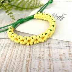 "Bring the beauty of nature to your wrist with our boho Sunflower bracelet.  Unique boho style bracelet, hand-woven made with waxed cord. Beautiful design for everyday wear.  This boho flower bracelet enhances your casual weekend outfit.  This bracelet is the perfect accessory for anyone who loves nature-inspired jewelry, boho chic style, or just wants to add a touch of sunshine to their outfit. It's also a great gift idea for birthdays, anniversaries, or any special occasion. ♥ ITEM DETAILS: To Adjustable Flower Friendship Bracelets For Beach, Beach Jewelry With Braided Nylon Cord, Flower Friendship Bracelets For Beach, Braided Nylon Cord Jewelry For Beach, Yellow Braided Bracelets For Beach, Beach Braided Nylon Cord Jewelry, Beach Braided Nylon Cord Bracelets, Braided Nylon Cord Bracelets For The Beach, Handmade Friendship Bracelets With Nylon Cord For Beach