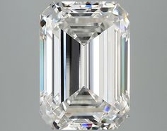 an emerald - cut diamond is displayed on a gray background with the reflection of it's face