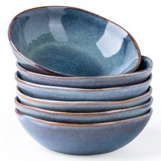 a stack of blue bowls sitting on top of each other