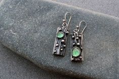 Elegant earrings that are designed to be passed down for generations to come! Features a silver base with blackened textured detailing and man grown light green corundum gemstone. With a color that complements every metal, my quartz earrings are crafted in sterling silver, designed and crafted by hand using techniques of sawing, hammering, soldering and oxidizing.  Height with hook 48mm These earrings will come delivered in a lovely wooden box. Hopefully, this piece of work will find somebody that will love it as much as I do!  This special earrings can be a great gift for your beloved one or for yourself. All my items are shipped with tracking number. Diy Jewelry Earrings, Soldering Jewelry, Handcrafted Artisan Jewelry, Tree Bark, Black Earrings, Quartz Earrings, Dainty Earrings, Sea Glass Jewelry, Artistic Jewelry