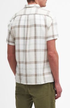 A gauzy blend of linen and silky lyocell brings relaxed comfort to a shirt patterned in a pale plaid and styled to be left untucked on warm, sunny days. 30" length, 44" chest (size medium) Front button closure Spread collar Short sleeves Chest patch pocket 55% linen, 45% lyocell Machine wash, line dry Imported Casual Flax Button-up Shirt, Casual Flax Button-up Top, Casual Flax Color Top With Spread Collar, Casual Flax-colored Top With Spread Collar, Casual Flax Top With Spread Collar, Casual Neutral Linen Tops, Casual Cotton Shirt In Flax Color, Casual Linen Shirt With Relaxed Fit, Beige Relaxed Fit Shirt For Casual Gatherings