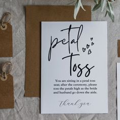 wedding stationery with handwritten love notes and rings on the table next to each other