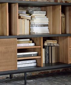 a book shelf with books and magazines on it