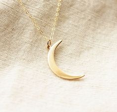 Dainty Crescent Moon Necklace♥The most tiny & dainty everyday necklace. Featuring a gorgeous golden bronze crescent moon (31x10mm) that dangles from the most delicate & shimmering gold filled chain. A gorgeous necklace that you will reach for everyday.. Necklace measure 18 inches as pictured. Completed with a round spring clasp. ♥Your purchase will come thoughtfully packaged and ready for gift giving. If this purchase is a gift that we are shipping directly to the recipient, please let me know i Elegant Everyday Crescent Charm Necklace, Half Moon Brass Necklace For Gift, Elegant Brass Charm Necklace With Moon Charm, Elegant Brass Moon Charm Necklace, Moon Necklace Gold, Necklaces Dainty, Diamond Cross Necklace Gold, Double Horn Necklace, White Diamond Necklace