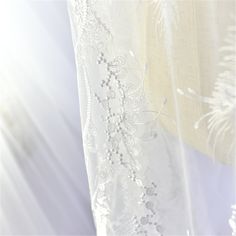 "This stunning Lace Fabric design piece has soft hand feel, It's perfect for weddings, bridal parties, and any events. Shop our large inventory of bridal fabrics. ☆PRODUCT DESCRIPTION : This gorgeous fabric is made on a sheer base with a beautiful flower embroidery throughout. The fabric width is approximately 51\" (130cm) Wide. Color: off-white as in picture Material: Rayon, Polyester ☆ PURCHASING INFORMATION: This fabric is sold by the yard and each Qty you enter will represent 1 yard of fabri Elegant Embroidered Tulle Gown, Wedding Gown With Floral Embroidery And Tulle Material, Floral Embroidered Tulle Gown For Wedding, Elegant Embroidered Organza Wedding Dress, Elegant Embroidered Tulle Lace, Sheer Lace Wedding Gown, Lace Tulle Fabric With Floral Embroidery For Wedding, Wedding Tulle Fabric With Floral Lace Embroidery, White Tulle Gown With Pearl Embroidery