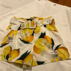 Nwot Unbranded Boutique High Waist, Pleated, Belted Lemons & Floral Design Shorts Sz. S, Super Cute Can Be Worn For Dress Or Casual. See Pics,Great Gift. 13” Waist 18” Hips 14” Length Measurements Are Approximate And Are Taken Laying Flat Casual Bottoms With Lemon Print For Spring, Casual Lemon Print Bottoms For Spring, High Waist Yellow Shorts For Spring, Yellow Shorts With Pockets For Spring, Spring Yellow Shorts With Pockets, Fitted Bottoms With Lemon Print For Spring, Yellow Lemon Print Bottoms For Summer, Yellow Shorts With Pockets For Day Out, Spring Lemon Print Bottoms