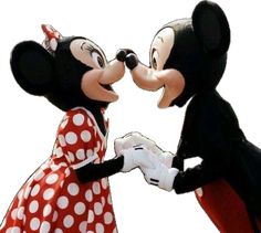 mickey and minnie kissing each other in front of a white background with red polka dots