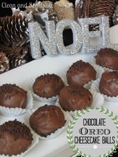 chocolate oreo cheesecake balls on a platter with christmas decorations in the background