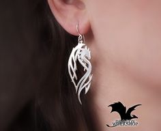 "Earrings \"Dragon Guardian\" Earrings are made in the kit to the Cuff \"Dragon Guardian\". It's very original, delicate and elegant decoration that is sure to attract attention. The earrings is made in the form of a dragon guardian, they will defend and protect you. Dragons will bring strength and confidence. The decoration is very elegant and easy, they are will be mascots in any situation. Possible materials of manufacture: \"Silver\" -  Nickel Silver (Jewelry alloy of silver color, does not contain silver. Other name: Maillechort, German silver.) \"Gold\" - Brass (Jewelry alloy of gold color) \"Sterling Silver\" - 925 Sterling Silver (This is a precious 925 alloy) All the jewelry in my shop is made by hand. With love and individually. This means that minor differences from the original Sterling Silver Fantasy Jewelry With Dragon Design, Fantasy Style Pierced Cartilage Earrings For Gift, Silver Fantasy Pierced Earrings, Silver Dangle Fantasy Earrings, Pierced Silver Fantasy Earrings, Fantasy Style Metal Earrings For Gift, Fantasy Metal Earrings For Gift, Fantasy Style Silver Cartilage Earrings For Gifts, Silver Fantasy Style Cartilage Earrings As Gift