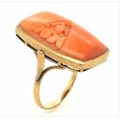 Presenting A14k Yellow Gold Angel Skin Coral Ring, Adorned With A Delicate Flower Motif. This Ring, Sized Perfectly At 5 1/4 (Able To Be Sized For Most Fingers), Features A Slim 1.70mm Shank For Both Comfort And Style. The Centerpiece Of This Ring Is A Sublime Piece Of Angel Skin Coral, Cradled In A Warm 14k Yellow Gold Bezel Setting. The Intricate Flower Motif Hand Carved Adds A Touch Of Nature's Own Artistry To The Design. With Dimensions Of Approximately 1" In Length, 11/16" In Width, And A Coral Ring, Coral Jewelry, Orange Gold, Delicate Flower, Bezel Setting, Womens Jewelry Rings, Yellow Gold Rings, Statement Rings, Hand Carved