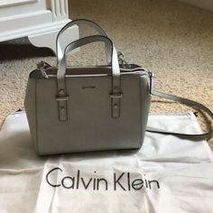 Nwot. Perfect Condition. Has Adjustable And Removable Long Strap. Is A Good Size And Has Lots Of Zippers And Pockets. Beautiful Silver Color. Height ~8 Inches, Length ~11 Inches Silver Shoulder Bag With Top Carry Handle For Travel, Silver Satchel Shoulder Bag With Top Carry Handle, Modern Silver Bag With Top Carry Handle, Silver Top Handle Bag For Everyday Use, Silver Tote Shoulder Bag With Top Carry Handle, Silver Bags With Top Carry Handle For Daily Use, Modern Silver Shoulder Bag With Top Carry Handle, Modern Silver Shoulder Bag With Top Handle, Elegant Silver Bag For Everyday Use