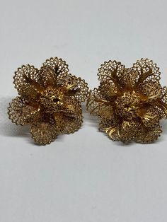 For their age these are in immaculate condition- looks like they have never been worn Beautiful Italian Gold Plated Filigree 1950/60s Screw Back Earrings To Depict a Flower Size 30mm Diameter  Screw backs work as they should Any boxes shown are for display purposes only and not included  Your item will come in a Presentation organza gift pouch FREE UK TRACKED POSTAGE Vintage Yellow Gold Evening Earrings, Vintage Yellow Gold Earrings For Evening, Vintage Earrings With Intricate Design, Vintage Earrings With Intricate Design For Evening, Vintage Flower-shaped Pierced Jewelry, Vintage Yellow Gold Clip-on Earrings For Party, Vintage Filigree Earrings For Evening, Vintage Earrings With Intricate Design For Formal Events, Vintage Earrings With Intricate Design For Formal Occasions