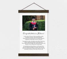 a graduation photo hanging on a wall with the words congratulations to someone who is graduating