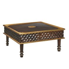 a wooden table with an intricate design on top