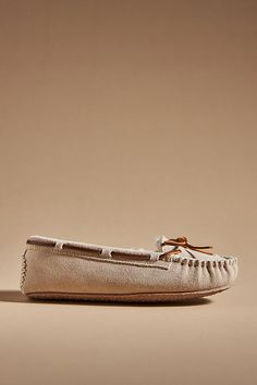 Suede upper Faux-fur insole Rubber sole Slip-on styling Imported | Cally Moccasins by Minnetonka in Grey, Women's, Size: 7, Rubber/Suede at Anthropologie Beige Moccasins With Leather Footbed, Beige Suede Flat Moccasins, Beige Suede Slippers With Round Toe, Beige Suede Round Toe Slippers, Winter Suede Moccasins With Round Toe, Fall Suede Moccasins, Winter Moccasins With Round Toe, Fall Slippers With Suede Lining And Round Toe, Pink Grey