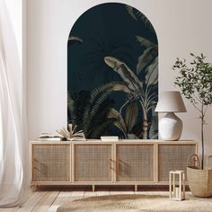 a living room scene with a plant on the sideboard