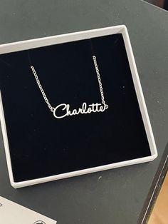 This necklace features a Dainty Sterling Silver Personalized Name Necklace with Chain. You can have your own name or word made. All carving will be made in the font as the photo.  This necklace and chain are dainty. DIMENSIONS Width - 2.3cm  Height - 0.3cm Total Weight - 3 gram Chain Size - 1.2mm This Jewellery comes in a box ready for gifting.  Please select necklace length from the drop-down box during check out. You may choose to buy Name+Chain or just our Chain without the name in the option Customizable Silver Chain Necklace For Gift, Customized Silver Nameplate Chain Necklace, Custom Name Adjustable Pendant Necklace, Silver Name Necklace For Birthday Gift, Custom Name Necklace Adjustable For Birthday Gift, Customized Silver Necklaces For Birthday Gift, Custom Name Adjustable Necklace For Birthday, Adjustable Custom Name Necklace For Birthday, Custom Name Adjustable Necklace For Birthday Gift