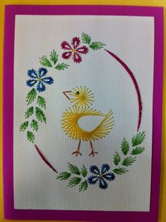 a card with an image of a bird in a circle surrounded by flowers and leaves