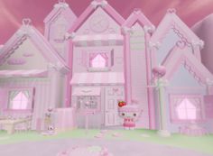 a pink hello kitty doll house in the middle of a room