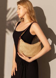 Indulge in luxury with our Woven Raffia Saddle Bag, expertly crafted with a blend of raffia and leather. Its adjustable shoulder strap ensures a perfect fit for women of all sizes. Elevate your style with this exclusive and elegant addition to your wardrobe. Size info 10 5/8" (27cm) width 6 3/4"(17cm) height 3"(8cm) depth Details Raffia and genuine cowhide leather Polyester lining Adjustable shoulder strap Interior wall pocket and zipper pocket Top zip closure Item #462501 Women's saddle shoulde Women Of All Sizes, Woven Raffia, Pocket Top, Interior Wall, Saddle Bag, Wall Pockets, Dress Pant, Bag For Women, Sweater Coats