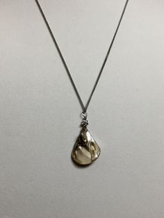 "Available in 16\", 18\" Sea shell pendant silver stainless stainless curb chain necklace, ornate with a 5mm silver plated alloy metal flower bead. Hand made jewelry! All purchase will arrive in gifts boxes. Thanks for stopping by!" Elegant Stainless Steel Nickel-free Charm Necklace, Elegant Teardrop Stainless Steel Necklaces, Silver Teardrop Pearl Pendant Jewelry, Elegant Stainless Steel Flower Pendant Necklace, Adjustable Silver Charm Necklace With Flower Pendant, Silver Adjustable Flower Pendant Charm Necklace, Handmade Teardrop Silver Pearl Necklace, Silver Charm Necklace With Flower Pendant, Handmade Silver Teardrop Pearl Necklace