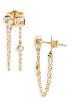 These sparkling earrings boast shimmering checkerboard-cut topaz, round-cut diamonds and draping chains handcrafted in 14-karat gold. 1" drop Post back Total topaz weight: 0.06ct. Total diamond weight: 0.06ct. Color: G–H Clarity: SI2 14k gold/topaz/diamond Made in Canada >Diamond Guide Diamond Earrings With Adjustable Chain, Evening Dangle Earrings With Single Cut Diamonds, Evening Single Cut Diamond Dangle Jewelry, Diamond Earrings Fine Jewelry, Fine Diamond Earrings, Sparkling Earrings, Gold Topaz, Diamond Guide, Double Chain