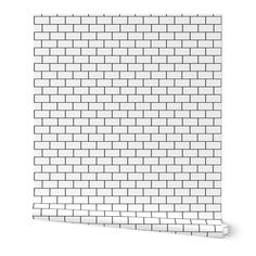 a white brick wall is shown with no bricks on the bottom and one side, as well