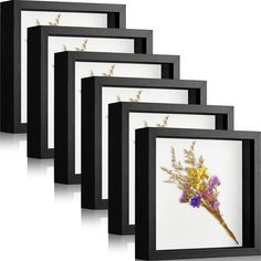 four framed pictures with flowers in them on a white background, one is black and the other is yellow