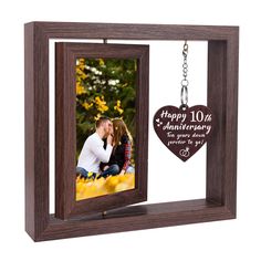 an anniversary photo frame with a keychain hanging from it's front and side