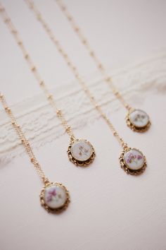 Clara Necklace These vintage inspire necklaces draw attention back to old world design. Each necklace features an antique pendant, pearl backdrop, and a pink alyssum bouquet.  24K antique gold plated Pendant measures 20x20mm  16-18" Gold Plated Satellite Chain Handmade   Each Piece is handmade with real flowers which means every piece is one of a kind, slight variations make each piece unique. Boho Wedding Necklaces For Bride, Trend Necklace 2024, Boho Wedding Necklace, Flower Cottagecore, Pearl Backdrop, Cottagecore Necklace, Old World Design, Dried Flower Necklace, Necklace Drawing