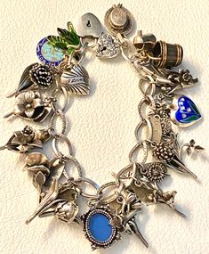 Antique Sterling Silver Garden Charms Bracelet Flower Of Month Puffy Hearts Lock Flower Of Month, Silver Garden, Bracelet Flower, Heart Lock, Charms Bracelet, Charming Garden, Danbury Mint, Puffy Heart, I Forgot