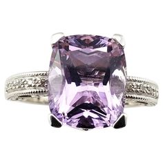 14 Karat White Gold Amethyst and Diamond Ring- This stunning ring features one cushion cut amethyst (12 mm x 9 mm), two square cut amethysts and ten round brilliant cut diamonds set in elegant 14K white gold. Shank: 1.5 mm Amethyst carat weight: 8.50 ct. (Amethyst weighed and authenticated by GAI) Amethyst clarity grade: AAA Total diamond weight: .05ct. Diamond color: champagne Diamond clarity: L-N Ring Size: 8 Weight: 3.0 dwt. / 4.8 gr. Tested for 14K gold. Very good condition, professionally polished. Will come packaged in a gift box or pouch (when possible). Estate Diamond Jewelry, Amethyst And Diamond Ring, Gold Cushions, Color Champagne, Champagne Diamond, Square Cut, Multi Stone Ring, Diamond Color, Round Brilliant Cut Diamond