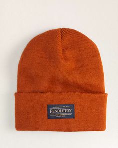 A Classic Beanie In A Soft, Stretchy Ribbed Knit With Pendleton Logo Patch On The Turn-Back Brim. Acrylic Hand Wash Made In USA Of Imported Material | PENDLETON BEANIE Classic Fitted Beanie For Cold Weather, Classic Fitted Knitted Beanie, Casual Fitted Ribbed Hat, Classic Solid Beanie For Fall, Classic Beanie For Cold Weather, Classic Fitted Beanie For Fall, Classic Fitted Warm Beanie, Classic Warm Fitted Beanie, Ribbed Fitted Hats For Fall