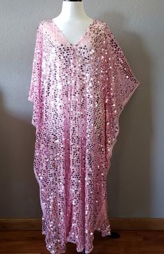 Made to order...Pink Sequin Caftan DressLarge iridescent round sequinPink Sheer lightweight fabricOversized kimono style sleevesOne Size Fits MeasurementsWidth: 46" (armpit to arm pit)Total Length : 50-56" CareHand Wash Cold Please allow me 2-3 business days to make the item prior to shipping. Spring Party Kaftan With Kimono Sleeves, Summer Party Dress With Kimono Sleeves, Summer Party Dress With Batwing Sleeves, Sequined Summer Evening Kaftan, Summer Evening Kaftan With Sequins, Sequined Kaftan For Evening In Summer, Summer Festive Sequined Kaftan, Sequin Kaftan For Evening And Summer, Pink Kaftan For Spring Evening