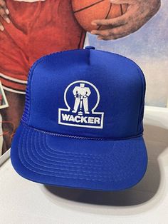 This vintage trucker hat is a must-have accessory for any 80s enthusiast. Its blue color with a mesh back and adjustable snapback make it a perfect fit for any head size. With a humorous WACKER logo on the front, this hat is sure to be a conversation starter. Ideal for completing any casual outfit, this hat is a great addition to your collection. Vintage Trucker Hat, Vintage Trucker Hats, Hats Snapback, Humor Funny, Trucker Cap, Casual Outfit, Caps Hats, Trucker Hat, Accessories Hats