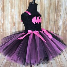 FREE SHIPPING on all orders within the US, no coupon code needed! Batman Tutu by Little Ladybug Tutus. Handmade Tutus for girls specializing in birthday party dresses, Halloween costumes, flower girl dresses, pageant tutus, 1st birthday tutus, and blinged Converse sneakers. We accept custom orders! ORDER PRODUCTION TIME Please check the top of our website main page for current turn around time. Since all items are handmade at the time of purchase, there is a production time that varies. We do no Cute Pink Tutu Dress For Costume Party, Cute Black Tutu Dress, Playful Purple Tutu Dress For Birthday, Pink Tutu Dress For Carnival Party, Pink Tutu Dress For Costume, Playful Halloween Party Tutu Dress, Fitted Playful Costume Tutu Dress, Cute Halloween Tulle Tutu Dress, Whimsical Pink Tutu Dress For Costume