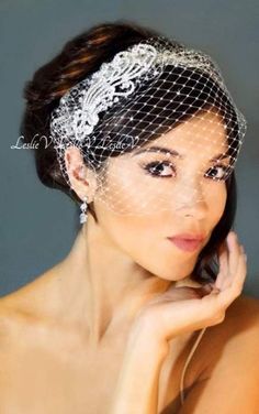 a woman wearing a veil and holding her hair in front of her face with the words,