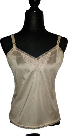 Lorraine's women’s off-white, nylon intimates. Very Good condition, size S (4). Detailed measurements:Bust - 30 inchesWaist - 30 inchesBody Length - 20.5 inches to 25 inches Fitted Coquette Camisole Tank Top, Fitted Cream Camisole With Built-in Bra, Cream Camisole With Built-in Bra And Spaghetti Straps, Fitted Cream Tank Top With Built-in Bra, Fitted Bra-friendly Camisole In Coquette Style, Coquette Camisole With Built-in Bra, Fitted Cream Tank Top With Lace Trim, Beige Sleeveless Bra-friendly Camisole, Beige Bra Friendly Sleeveless Camisole