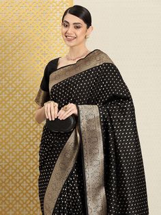 Black banarasi sareeEthnic motifs woven design saree with woven design borderHas zari detailThe saree comes with an unstitched blouse pieceThe blouse worn by the model might be for modelling purpose only. Check the image of the blouse piece to understand how the actual blouse piece looks like. Black Pre-draped Saree With Zari Weaving For Puja, Black Banarasi Silk Blouse Piece For Eid, Elegant Black Blouse With Zari Weaving, Black Traditional Saree For Formal Occasions, Traditional Black Saree For Formal Occasions, Black Pre-draped Saree With Zari Weaving In Art Silk, Festive Saree Blouse Piece With Border, Formal Cutdana Saree For Navratri, Formal Pre-draped Saree With Zari Weaving For Eid