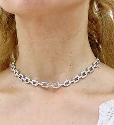 This stunning 4.50ct t.w. diamond link choker statement necklace will instantly elevate any look. Showcasing exquisite diamond brilliance and timeless style, it's sure to be the perfect addition to your finejewelry collection. Sparkling and sophisticated, you'll look and feel like a million bucks! Metal: 18K White GoldDiamond Shape: Round Brilliant-cuts Diamond Weight: 250 Round brilliant cut 4.50ct tw Dimensions: 8mm wideLenght: 40cm Statement Choker Necklace, Round Brilliant Cut Diamond, Round Brilliant Cut, Brilliant Cut Diamond, Round Brilliant, Timeless Style, Feel Like, Timeless Fashion, Diamond Cuts