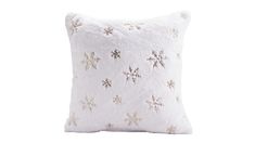 a white pillow with snowflakes on the front and back, against a white background