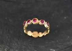 Gold Ruby Ring set with a Created Ruby in a perfect diamond cut & bright red color with perfect clarity, at 3mm diameter each, 1 Carat combined.Gold Bubble Band made of Gold Vermeil ☞ thickest 18k Gold Plating on top of Solid 925 Sterling Silver ☞ made to last.☞ Choose your size ☞ I resize (before shipping) for FREE to Any size*Matching Pendant & Matching Earrings - please ask me⌛Last Ring left ⌛Details : ♥ Each item comes in a cute GIFT BOX ✓ ♥ GUARANTEE on the materials ✓♥ Created Ruby Red Bezel-set Round Band Rings, Red Ruby Jewelry With Bezel Setting, Red Ruby Ring With Bezel Setting, Stackable Red Ruby Ring, Red Bezel Set Round Cut Ring, Red Stackable Rings With Round Band, Red Bezel Set Ring Jewelry, Red Bezel Setting Ring, Red Bezel Set Ring