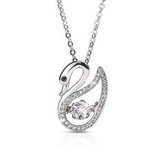 Swans represent grace and beauty. Here we bring to you an elegant swan; delicately crafted by jewelry artisans from sterling silver, cradled by smaller flawless Diamondeau® - the Supreme Diamond Alternatives for added subtle sparkle. An elegant midnight black Diamondeau® - the Supreme Diamond Alternative sits at its eye as its head is nestled in a modest pose. This pendant features a revolutionary design where the center Diamondeau® - the Supreme Diamond Alternative is suspended and allowed to v Elegant Sparkling Diamond White Jewelry, Glamorous Sterling Silver Jewelry With Diamond Cut, Glamorous Silver Jewelry With Brilliant Cut, Luxury Sparkling Jewelry For Gifts, Silver Glamorous Jewelry For Gift, Sparkling Elegant Jewelry Gift, Glamorous Jewelry For Gifting With Elegant Design, Elegant Jewelry With Sparkling Stones For Anniversary, Luxury Sparkling Jewelry For Anniversary